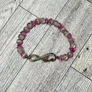 Pink glass beaded infinity bracelet with love charm. Handmade.